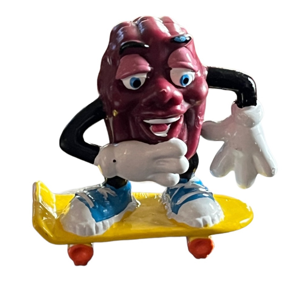 Vintage 1980s California Raisins Figure Riding a Skateboard Cake Topper